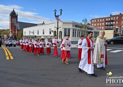 Father Mazzone leads procession