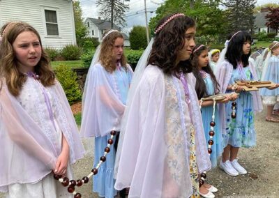 Middle School girls carry Rosary
