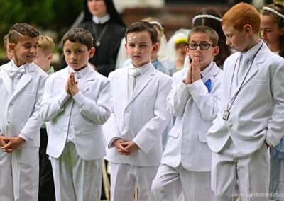 First Communicants join in procession