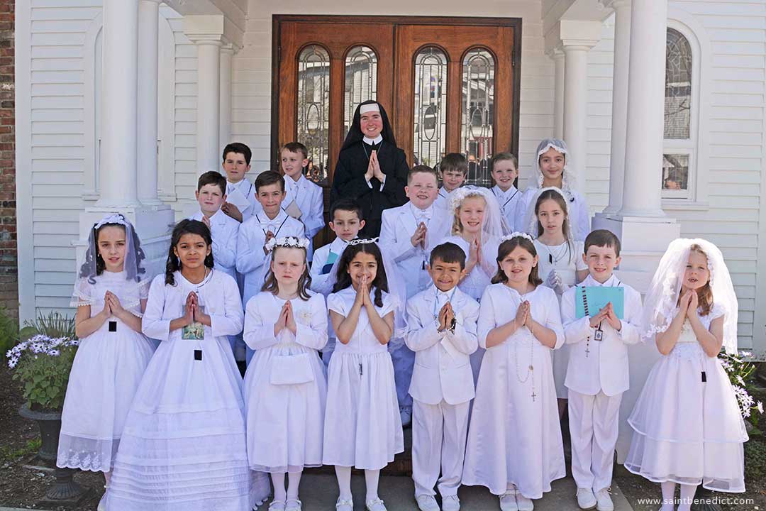 Sister Mary Imelda, MICM, with First Communicants 2023.