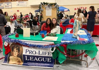 IHM Pro-Life Table at the Fair. - Saint Benedict Center IHM Pro-life booth Christmas Fair 2023