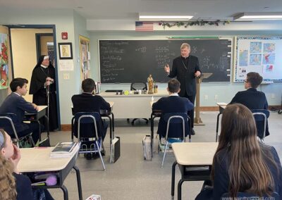 8th graders visit with Bishop McManus