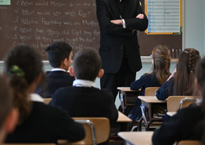 Grade 2 enjoys talking with the bishop