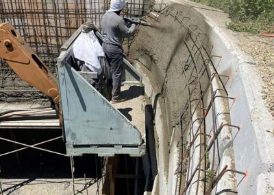 Spraying begins for the Lourdes Grotto at Saint Benedict Center, June 2026.